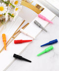 24 Pcs Wooden Cribbage Pegs Set For One Eighth Inch Holes With Eight Colors Replacement Tapered Pins on white surface