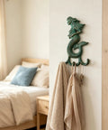 Premium Cast Iron Mermaid Wall Hook With Solid Metal Finish, 6.3in tall, holding towels and keys in a cozy bedroom.
