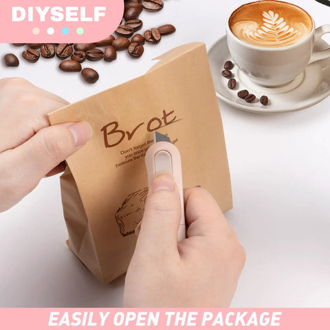 Using 8 Pack Mini Box Cutters for Packages and Projects to open a paper bag near coffee beans and a cup of latte.