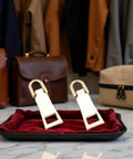 Two Pack Gold Zipper Pull Replacement Sliders for luggage and coats on red tray