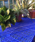 Plants on Lightweight Plastic Pallet Interlocking Storage System With Breathable Grid Design for Garage Warehouse Yard Kitchen Supermarket