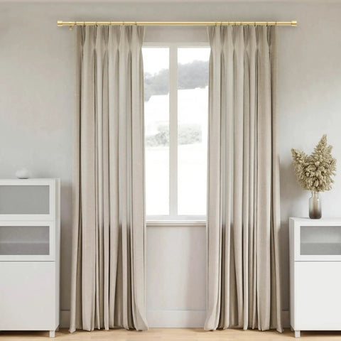 Gold Curtain Rods For Windows 66 To 120 Inches, 1 Inch Adjustable, displayed with beige curtains in a modern living room.