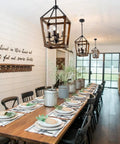 Rustic Farmhouse 4 Light Pendant Chandelier With Imitation Oak Wood Grain hanging over dining table, open cage style