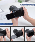 Hand holding Panasonic Lumix S9 with Street Ready S9 Hand Grip For Panasonic Lumix S9 Camera With L Shape Bracket And Built In Arca Quick Release Plate Battery Compartment Access Anti Slip Leather Pad For A Solid On The Go Shoot shown in use