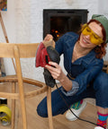 Person using Black And Decker Mouse Sanding Pads Pack With 60 80 120 150 220 Grits on wooden chair indoors
