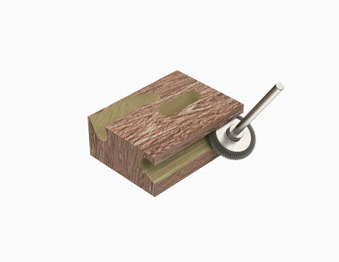 Extreme Rotor Saw Burr Wood Carving Bit, One Eighth Inch Shaft, Very Coarse Grind rotating against wooden block