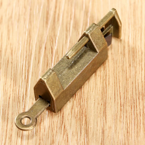 Close-up of Antique Bronze Cabinet Hinges With Lock Latch Hasp 2 Pack for Wooden Boxes and Cupboards on wood surface