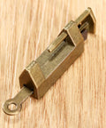 Close-up of Two Pack Antique Bronze Cabinet Hinges With Lock Latch Hasps For Vintage Wooden Boxes And Cupboards on wood surface.