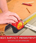 Person using Pro Grade Heavy Duty Retractable Imperial Pocket Tape Measure With Nylon Coating on a wood surface
