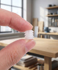 Close-up of hand holding white dowel from Heavy Duty Hinge Dowel Inserts Kit With M4x8mm Expansion Nuts And Self Tapping Screws.