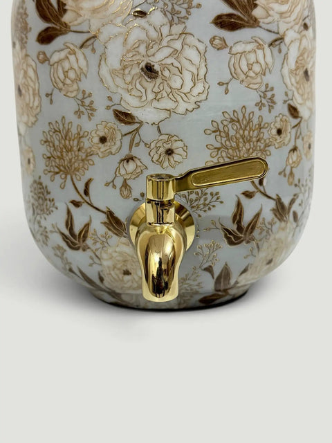 Floral detail of Blue Enamel Copper Water Dispenser With Lid And Tap Handmade Indian Pot for drinking water storage.