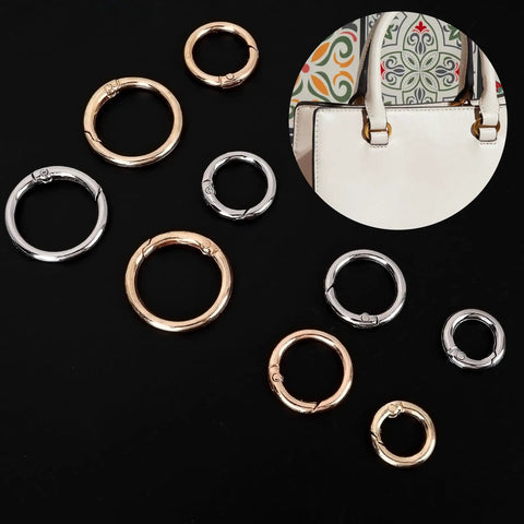 16 Pcs Mini O Ring Clip Spring Carabiner Set For Bags And Purses And Handbags, Round Gold And Silver O Rings And Clasps, Four Sizes For DIY Jewelry Making And Craft Projects; assorted gold and silver alloy rings on black