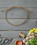 Replacement Control Cable For Riding Lawn Mowers And Tractors 100cm Iron Shaft Core on wooden background with garden tools