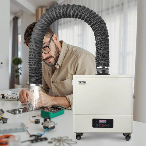 Heavy Duty Solder Fume Extractor Delivering Beast Mode Suction Power With Four Stage Filtration And Wireless Remote Control For Soldering Laser Engraving And Welding Projects in workshop with technician.