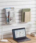 Two Pack Slatwall Magazine Display Pockets Clear Acrylic Literature Holders 8.5 W X 11 H X 2.5 D Slatwall Shelf Accessory installed on a wall.