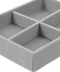 Velvet Jewelry Organizer Tray With Four Grid Compartments Stackable Minimalist Ring And Bracelet Tabletop showing soft gray material and compartments.