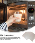 Hand placing glass in microwave open door with 12 Pieces Mica Sheets For Microwave Oven Waveguide Cover Heat Resistant Fireproof Insulation Pads