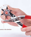 Hands adjusting beefy leather hole puncher workhorse with six punch sizes for belts, easy to use adjustable durable punch tool.