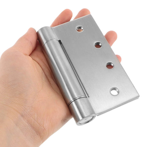 Heavy Duty Stainless Steel Self Closing Door Hinges With Adjustable Silent Operation For Residential And Commercial Interior And Exterior Doors being held in a hand.