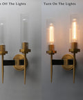 Antique Bronze Two Light Sconce For Bathroom Vanity With Dual Two Point Eight Inch Cylinder Glass Shades, off and on view.