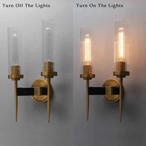 Antique Bronze Two Light Sconce For Bathroom Vanity With Dual Two Point Eight Inch Cylinder Glass Shades, off and on view.