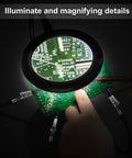 Helping Hands Soldering Station With 3X Magnifying Glass Light and 4 Flexible Arm Magnifier on green circuit board