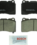 Bosch BC1001 QuietCast Premium ceramic brake pad set, four pads with grease packet (front and back views)