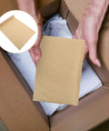 Hands holding Khaki Kraft Bubble Mailers Set 22x34cm Drop Resistant Padded Envelopes, focusing on self-sealing feature.