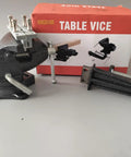 Versatile Clamp On Bench And Table Vise With 360 Degree Rotation Quick Adjustment Dual Purpose Jaw Heavy Duty Clamp For 4 Inch Base Clamping Range Home Shop And Workbench 3.3 Inch Jaw Size Black displayed with packaging