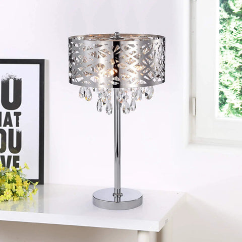 Chrome Crystal Accent Three Light Table Lamp With Steel Base And Wish Metal Shade on white table in bright room