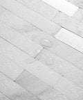 Close-up of Faux Stone Peel And Stick Backsplash Tiles 20 Sheets White Marble Look PVC Wall Tiles with water beads on surface