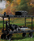 Heavy Duty Video Production Camera Cart Workstation For Filmmakers And Directors Smooth Rolling Studio Gear Stand with camera and bags outdoors.