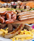 Stainless Steel Vertical Sausage Maker Filler With Suction Base And Manual Crank For Home Use Or Small Businesses No Batteries Needed Make Fresh Sausages And Hot Dogs At Home 2.5 Lbs Capacity - Assorted sausages displayed on a platter and served with side dishes. Focus keyword unfulfilled.