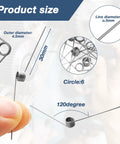 Close-up of small stainless steel torsion springs, 4.5mm outer diameter, 0.5mm wire for DIY repair