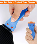 Plastic Razor Blade Scraper Set With 2 Scrapers And 60 Replacement Blades, Easy Grip Ergonomic Handle shown in use on black surface.