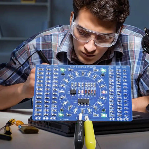 Person using DIY Soldering Practice Kit For SMD SMT Welding Training Board EK7026 With Water Lamp Circuit, blue PCB visible