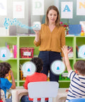 Teacher using Attention Grabbing Classroom Doorbell Set With 4 Push Buttons And 1 Receiver Waterproof Wireless Buzzer for lessons.