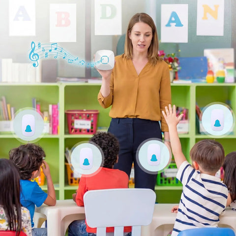 Teacher using Attention Grabbing Classroom Doorbell Set With 4 Push Buttons And 1 Receiver Waterproof Wireless Buzzer for lessons.