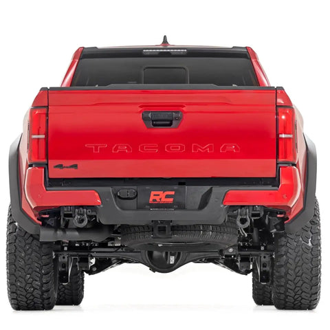 Rear view of truck with Rear Shackle Kit Beefed Up With D Rings And Rubber Isolators For Seven Eighths Pins Gloss Black Powder Coat