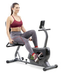 Person using Magnetic Recumbent Exercise Bike For Home Gym With Digital Monitor Quick Adjustable Seat Cushioned Backrest NS1206R