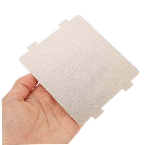 Hand holding a mica waveguide cover from 10-Piece Microwave Waveguide Cover Kit With Heat Insulation Mica Sheets For Microwave Ovens Anti-Splatter Shield Oil-Resistant Food-Safe Replacement Parts Must-Have For Your Go-To Home Kitchen And Everyday Cooking, close-up view.