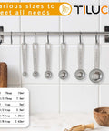 Six Piece Stainless Steel Measuring Spoons Set For Cooking And Baking displayed on a kitchen wall rack