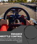 Driver holding steering wheel of go-kart featuring 84 Inch Go Kart Throttle Cable Kit for Coleman KT196 Predator engines, racetrack in view.
