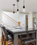 Slick Five Point Five Inch Seeded Glass Mini Pendant Light Featuring Badass Black Metal Hanging Fixtures For Kitchen Island And Dining Room above gray kitchen island.