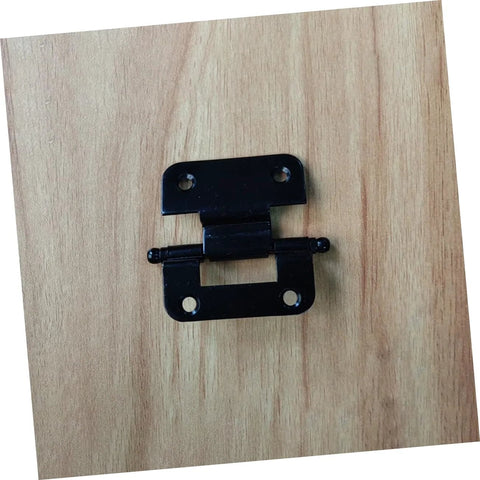 Black metal cabinet door hinge with dual mounting plates on wood surface