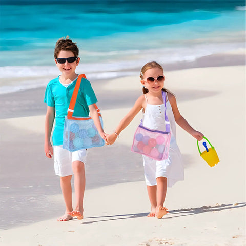 Children on beach with colorful mesh beach tote for kids, adjustable quick dry net bag, lightweight organizer in bright colors