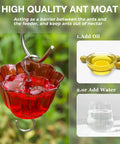 Red ant moat feature of Clear Glass Hummingbird Feeder For Outdoors With Six Feeding Ports Red Ant Moat Included 16 Oz Capacity