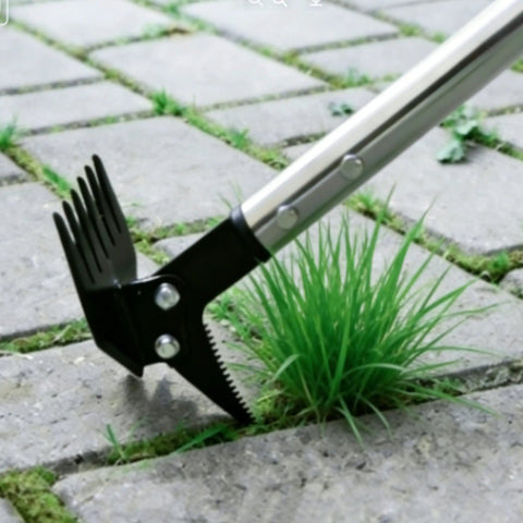 Close-up of 61 Inch Adjustable Weed Puller With Detachable Head, 2-In-1 Weed Rake And Crack Weeder in action on pavement.