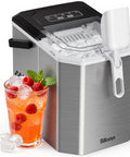 Sleek Countertop Ice Maker With Portable Stainless Steel Design And Easy Carry Handle next to a drink with ice and raspberries.