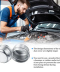 KickAss Heavy Duty Trailer Hub Dust Caps Two Point Zero Five Inch installed by mechanic with tools, showcasing grease protection features.